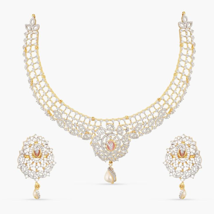 Description: Add a touch of timeless elegance to your look with this exquisite Nakshatra CZ necklace set. Crafted from high-quality CZ stones, and freshwater pearl drops, this jewelry is bold and beautiful. It features intricate ivy and floral motifs that capture the divine beauty of Indian culture. Perfect for special occasions or adding an extra sparkle to your everyday look, this necklace set is sure to make a lasting impression. Details & Specifications: Materials used: CZ stones with White Divine Beauty, Indian Culture, Authentic Indian, Cz Necklace, Bold And Beautiful, Floral Motifs, The Divine, Custom Necklace, Pearl Drop