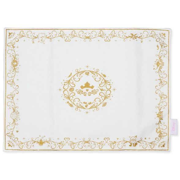 a white and gold placemat with an ornate design