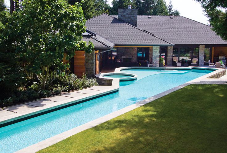 a house with a swimming pool in the front yard