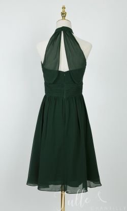 a green dress on a mannequin dummy