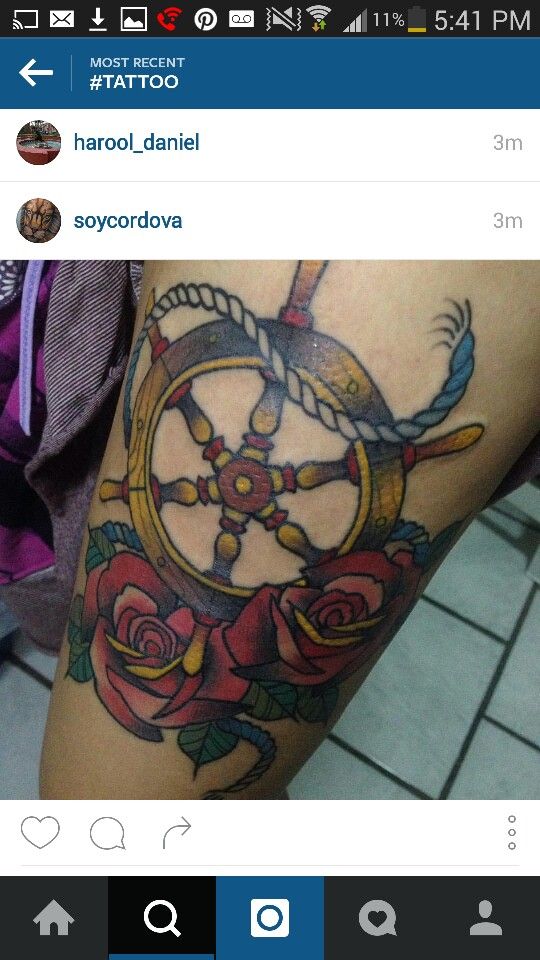 a person with a tattoo on their arm that has an image of a clock and roses