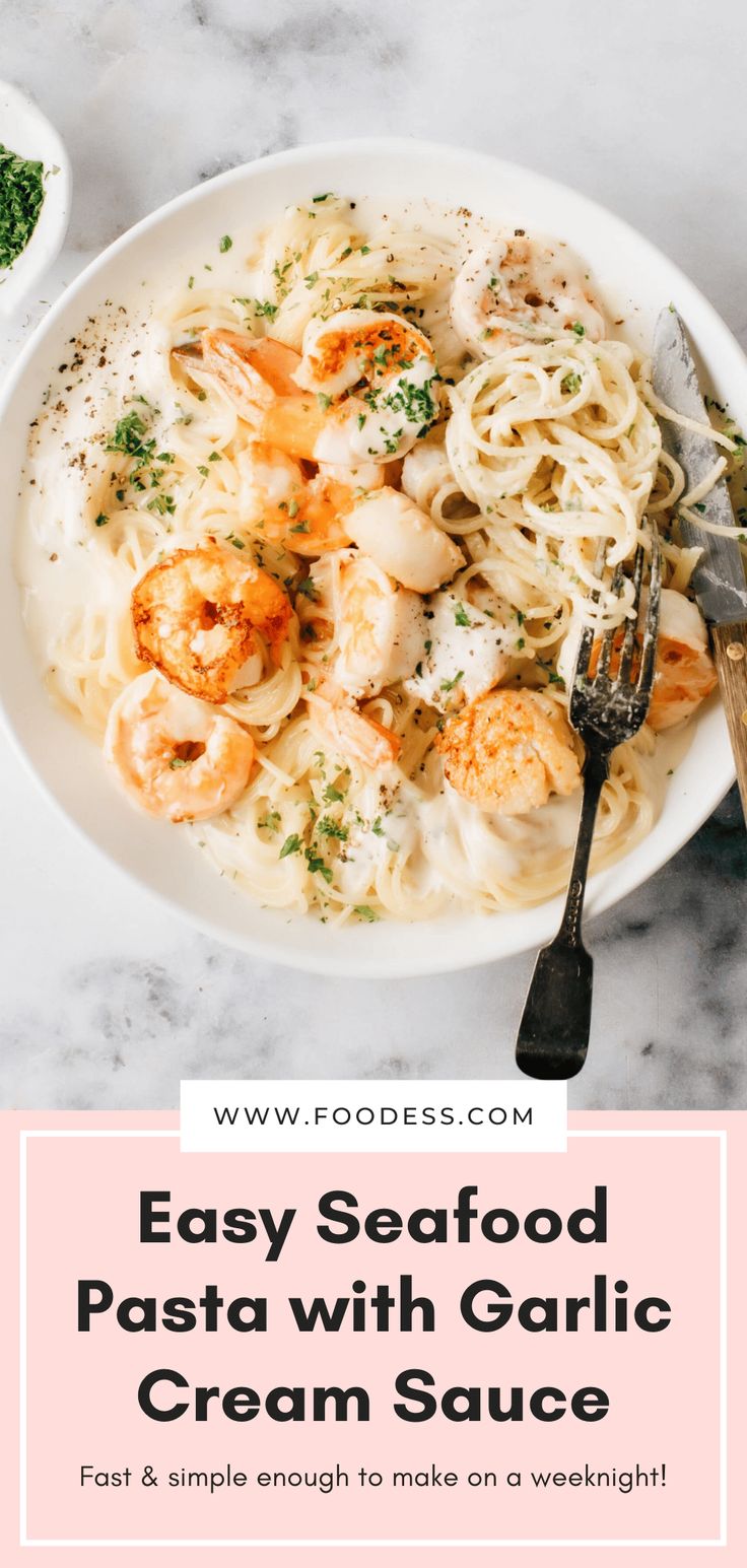 seafood pasta with garlic cream sauce in a white bowl