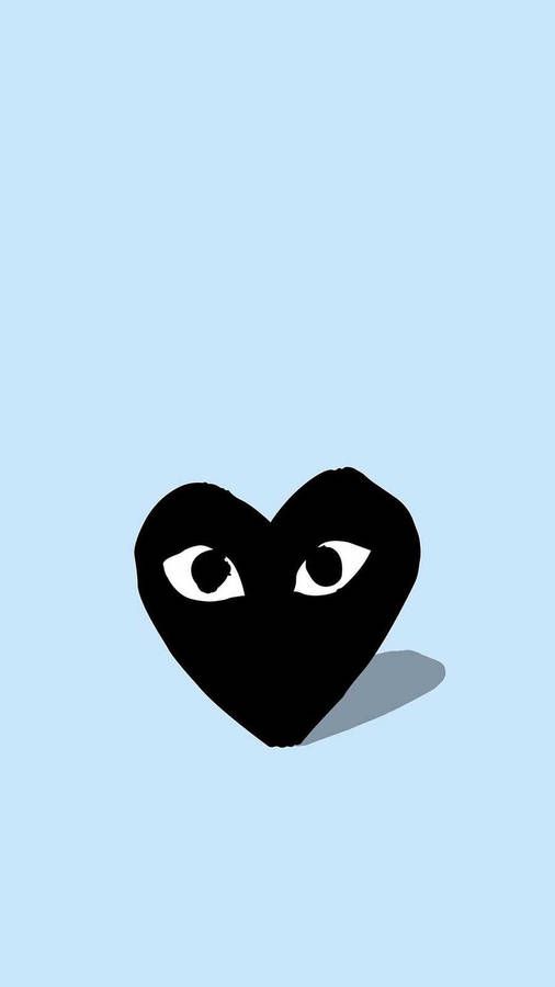 a black heart with two eyes on a blue background