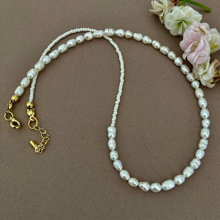 Buy Dainty Pearl Necklace Freshwater Pearl Necklace Rice Pearl Online in India - Etsy White Dainty Beaded Necklace With Adjustable Chain, Dainty White Beaded Necklace With Adjustable Chain, White Beaded Clavicle Chain Necklace As Gift, White Pearl Beaded Necklace With Adjustable Chain, Adjustable Pearl Clavicle Chain Necklace, White Beaded Necklace With Adjustable Chain As Gift, Adjustable Clavicle Chain With Round Beads, Pearl White Single Strand Beaded Necklace As Gift, Pearl Necklaces With Adjustable Chain And Round Beads