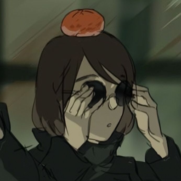 a woman holding her head in front of her eyes with an orange on top of her head