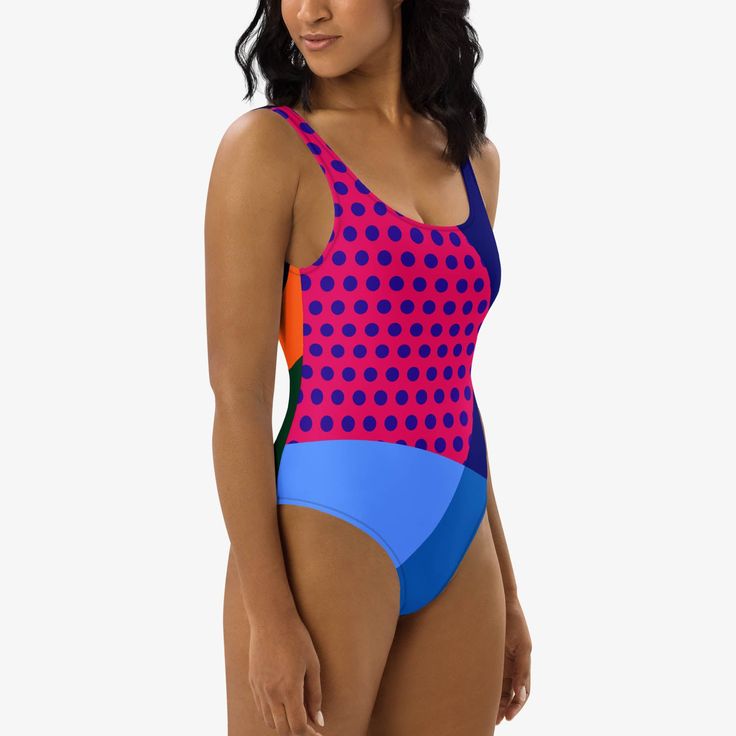 Make a splash with our vibrant "Polkalicious" one-piece swimsuit, designed to flatter all figures with its playful dot design. This swimsuit features smooth, chlorine-resistant fabric that enhances comfort and durability, while the cheeky fit, scoop neckline, and low scoop back offer a stylish look. The double-layered front and four-way stretch material ensure both coverage and ease of movement, perfect for a day by the sea or pool. Embrace style and function in one chic Swimsuit. Fitted Multicolor One-piece For Sunbathing, Fitted Playful Swimwear, Fitted Playful Swimwear For Swimming, Polka Dot Fitted Swimwear, Fitted Polka Dot Swimwear, Fitted Polka Dot Beachwear Swimwear, Polka Dot Swimwear For Summer, Polka Dot Summer Swimwear For Pool, Polka Dot Swimwear For Summer Swimming