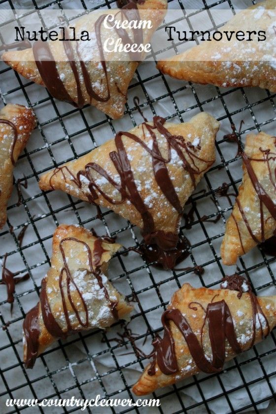 chocolate creme turnovers on a cooling rack with the words nutella cream turnoverers