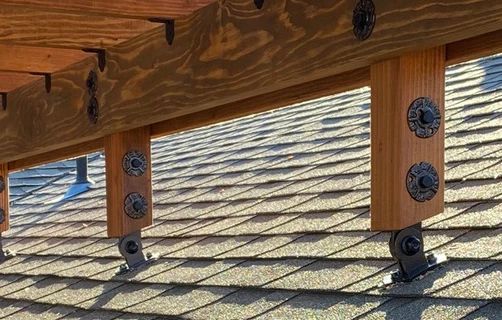 the roof is covered with shingles and screws