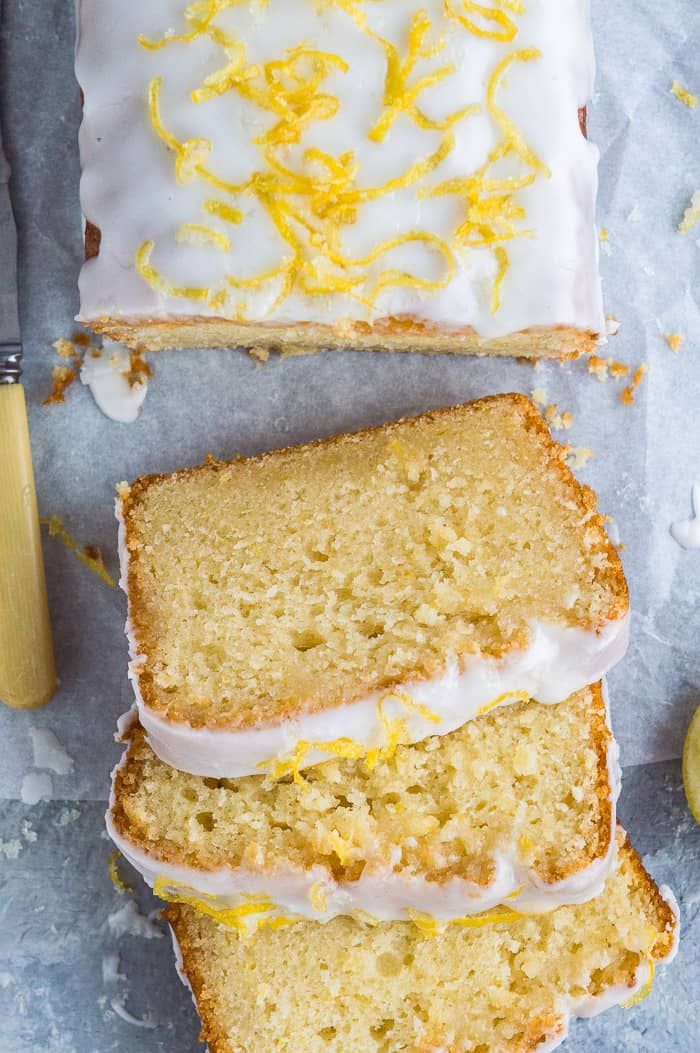 slices of lemon pound cake with white frosting and lemon zest on the top