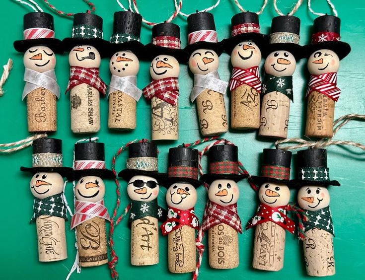 a group of cork snowmen with hats and scarfs