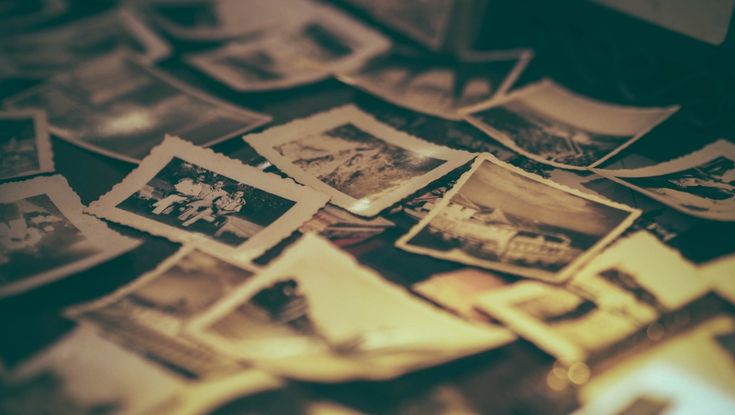 a pile of old photographs sitting on top of a table next to each other with the words photography museum london above them