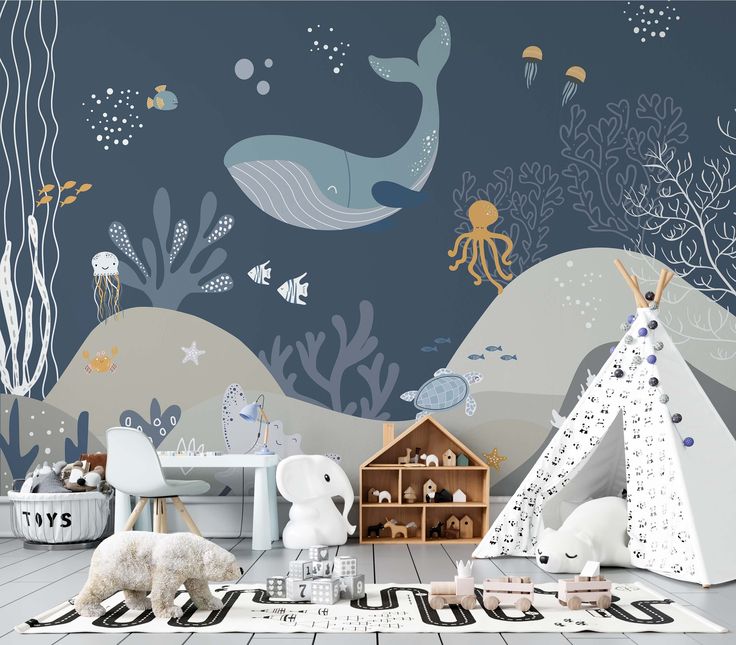 a child's room decorated in blue and white with an under the sea theme