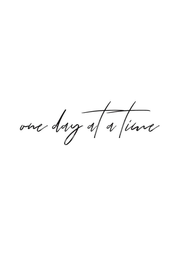 the words one day at a time written in cursive handwriting on a white background