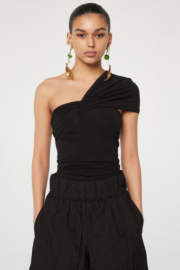 Kyo Tube Top - Black | The Line by K Summer Evening Off-shoulder Ruched Top, Summer Evening Ruched Off-shoulder Top, Ruched One-shoulder Top For Night Out In Summer, Summer One-shoulder Ruched Top For Night Out, Summer Ruched One Shoulder Top For Night Out, Stretch Off-shoulder Top For Summer Evenings, Ruched Off-shoulder Top For Summer Nights Out, Chic Ruched One Shoulder Top For Summer, Summer Evening Bandeau Top