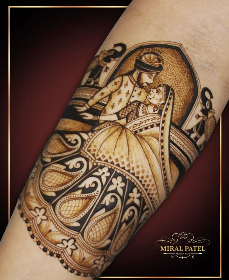 a woman's arm with an intricate tattoo design on it