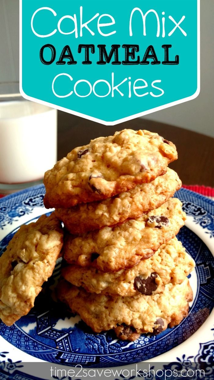 three oatmeal cookies on a blue and white plate with a glass of milk