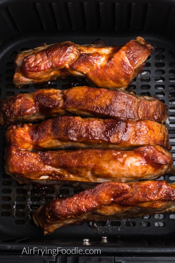 chicken wings cooking in an air fryer