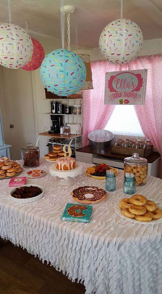 a table topped with lots of donuts and other desserts on top of it