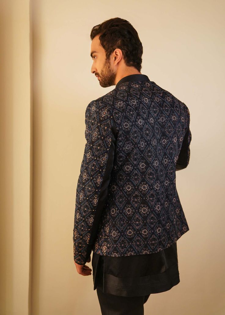 Editor's Note Featuring Our Bestseller Short Jacket, Now In A Midnight Blue Color. After Being A Hero Outfit For Consecutive Two Seasons, We Are Now Showcasing The Jamawar Embroidered Short Jacket With Dabka Highlighting, In Our New Color. Paired With Short Embroidered Hem Kurta With Tapered Trousers. Fabric: Linen Silk Color: Blue Component: Short Jacket, Kurta. Trousers Care: Dry Clean Only About the Designer After establishing himself as the leading couturier in the industry of menswear, Jati Tailored Long Sleeve Nehru Jacket For Party, Blue Nehru Jacket For Festive Workwear, Festive Blue Nehru Jacket For Work, Festive Blue Nehru Jacket For Workwear, Festive Long Sleeve Nehru Jacket For Work, Tailored Long Sleeve Bandhgala For Party, Long Sleeve Nehru Jacket For Party In Fall, Winter Party Bandhgala With Long Sleeves, Long Sleeve Nehru Jacket For Fall Party