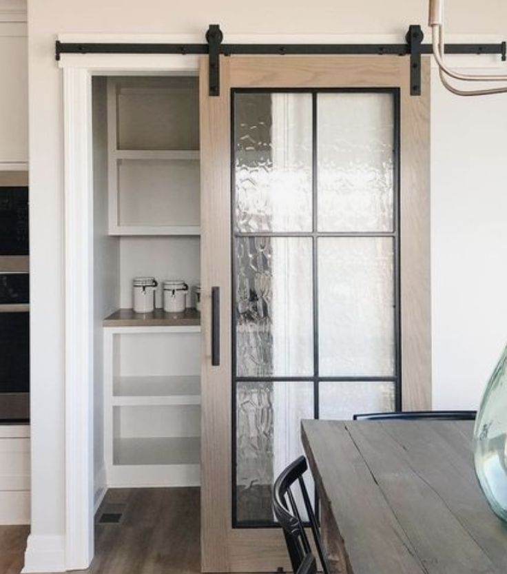 an open kitchen door leading to the dining room