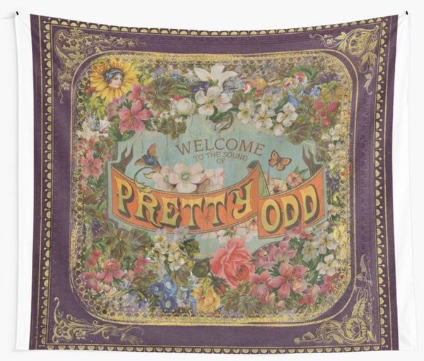 a tapestry with the words pretty odd written in floral designs on it's border