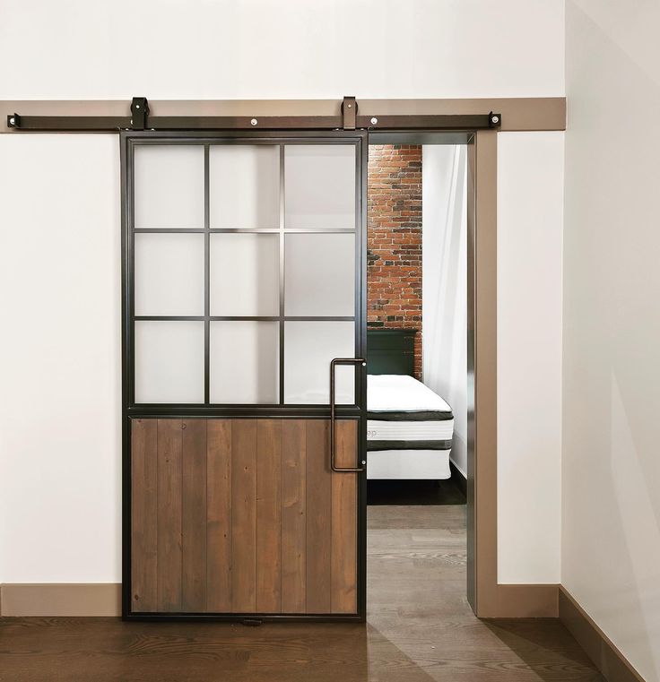 Everything about this door from the frosted glass to the Oil Rubbed Bronze hardware is simply stunning! Great pick @rebeccaphilipsondesign ✨ Thanks for sharing! The Mountain French Half Barn Door provides the perfect marriage between wood and glass! The product has the elegance of the classic french door design with a modern industrial twist. This door is available in both clear and frosted glass options to be accented by the wood panel. Steel Wood Door Design, Industrial Door Design, Barn Door With Window, Modern Dutch Door, Half Barn Door, Barn Doors With Glass Panels, Half Glass Door, Barn Door With Glass, Wood And Glass Door