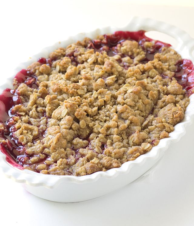 a pie with crumbled topping in a white dish