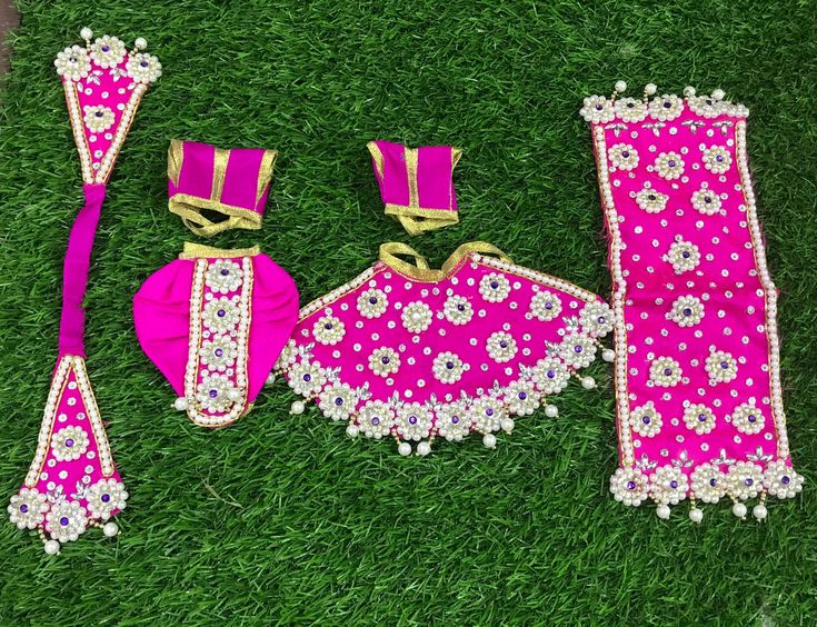 Very beautiful Radha Krishna heavy work poshak with Pearl and stone work Available in  Lehenga dhoti of 2 inches- ideal for 3-4 inches idol  Lehenga dhoti of 3 inches- ideal for 5-6 inches idol  Lehenga dhoti of 4 inches- ideal for 7-8 inches idol  Lehenga dhoti of 5 inches- ideal for 9-10 inches idol  Lehenga dhoti of 6 inches- ideal for 11-12 inches idol  Lehenga dhoti of 7 inches- ideal for 13-14 inches idol  Lehenga dhoti of 9 inches- ideal for 14-15 inches idol Lehenga dhoti of 12 inches- i Traditional Pink Sets With Gota Work, Fitted Mirror Work Sharara For Puja, Pink Traditional Sets With Gota Work, Fitted Sharara With Mirror Work For Puja, Pink Sets With Gota Work For Festivals, Pink Festival Sets With Gota Work, Pink Mirror Work Sets For Navratri, Eid Traditional Wear With Stone Work, Pink Sets With Mirror Work For Navratri