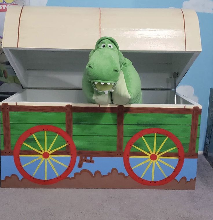 This was a fun project that I put together for Toystorylover33.  It was a genuine family effort from design, build, paint, etc...  also wanted to shout out to Steverichter.org  for sharing the basics for pulling off the replica.  The curved trunk lid was the most challenging part of the build.  Once complete, I turned it over to the real talent for paint.  Savyb owned this project and made my mediocre work excellence! Toy Story Wagon Ideas, Toy Story Toy Box Diy, Toy Story Room Ideas For Boys, Toy Story Wagon Halloween, Toy Story Trunk Or Treat Ideas, Toy Story Toy Chest, Toy Story Box Table, Andys Bedroom Toy Story, Toy Story Bedding