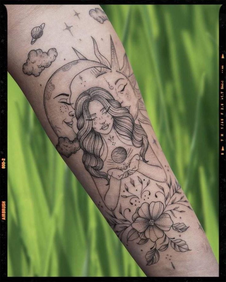 a woman's arm with flowers and a half moon tattoo on her left forearm