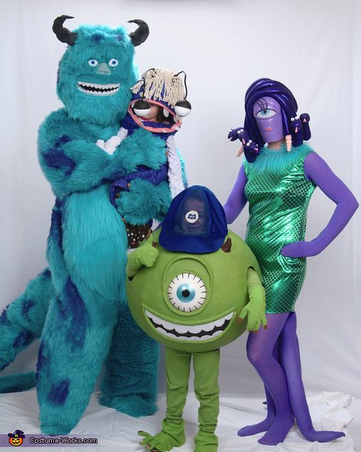 three people dressed in costumes standing next to each other