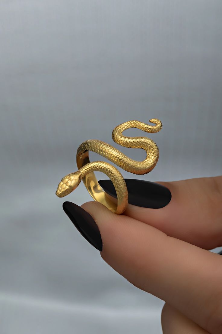 Whether it's a wedding celebration, a party, or simply an everyday accessory, this ring adds a touch of sophistication and style. The design of this ring features a sleek and modern interpretation of a snake, symbolizing transformation and power. Order yours today and let this ring become a symbol of empowerment and style in your collection. Features: * Material:14k Solid Yellow Gold * Dimensions: 15 cm * The measurement of the snake on the ring: 30.3 cm * The length of the part of the ring worn Reptile Accessories, Snake Ring Gold, Snake Rings, Birthday Jewelry, Dragon Jewelry, Prom Jewelry, Snake Design, Red Jewelry, Anniversary Jewelry