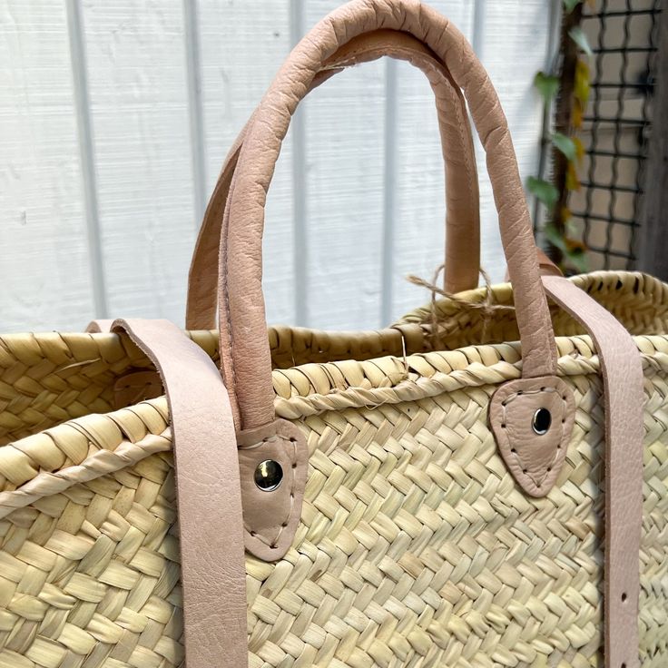 a close up of a woven bag on a table