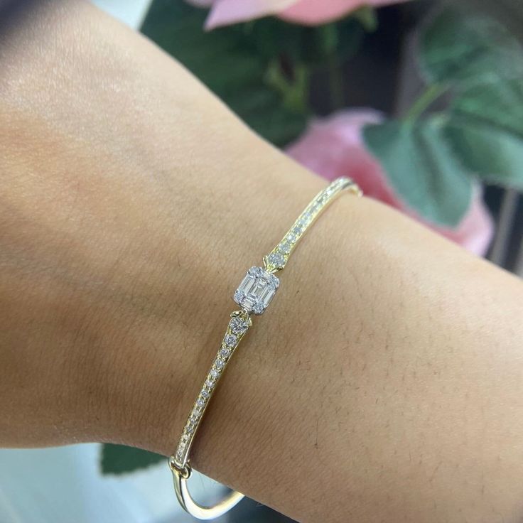 This bracelet is a true embodiment of refined beauty, crafted with exquisite attention to detail. It features a row of brilliant diamonds that sparkle and shimmer with unparalleled brilliance. With a total weight of 0.95 carats, these diamonds create a captivating display of light, adding a touch of glamour to any ensemble. Each diamond is meticulously set in a secure prong or bezel setting, allowing them to take center stage and steal the spotlight. The diamonds exhibit exceptional clarity and fire, captivating the eye with their radiant beauty. Their scintillating brilliance beautifully contrasts against the warm tone of the 14K yellow gold setting, creating a harmonious blend of luxury and style. Cubic Zirconia Diamond Bracelet With Pave Setting, Luxury Tennis Bracelet With Pave Setting For Anniversary, Elegant Diamond Bracelet With Emerald Cut Single Diamonds, Wedding Baguette Cut Diamond Bracelet Vvs Clarity, Emerald Cut Diamond Accents Tennis Bracelet, Baguette Cut Diamond Bracelet With Vvs Clarity, Baguette Cut Single Diamond Tennis Bracelet, Luxury Pave Setting Tennis Bracelet For Anniversary, Fine Jewelry Diamond Bracelet With Baguette Cut