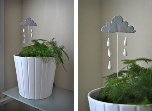 two pictures of a potted plant with rain drops hanging from it's sides