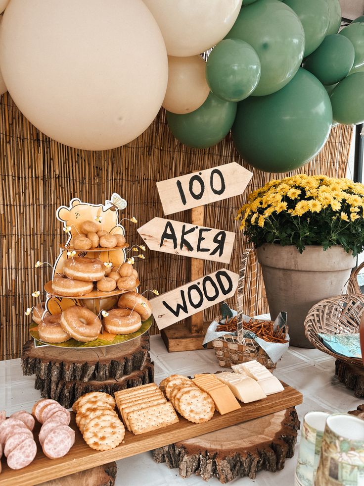 a dessert table with lots of donuts and pastries