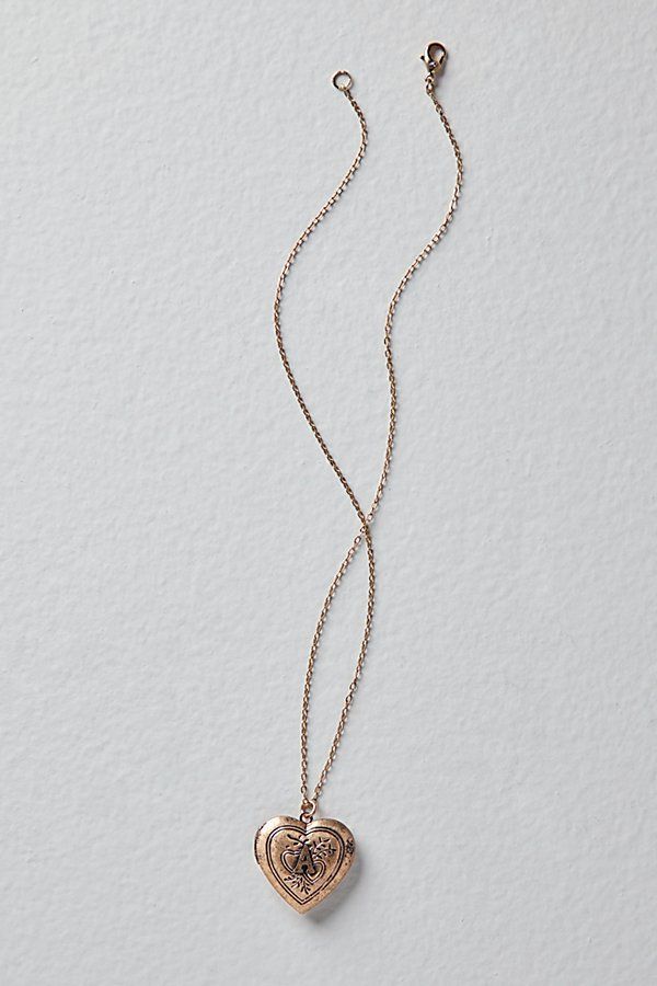 A super sweet gift or an accessory unique to you, this darling monogram necklace features a heart locket pendant with an initial engraving. **Features:** Dainty chain, heart locket pendant, hinge opening mechanism, monogram initial engraving, clasp closure **Why We | Monogram Necklace by Free People in Gold Meaningful Pictures, Gray Necklace, Chain Heart, Sweet Necklace, Dainty Chain, Meaningful Jewelry, Monogram Necklace, Funky Jewelry, Accessories Jewelry Necklace