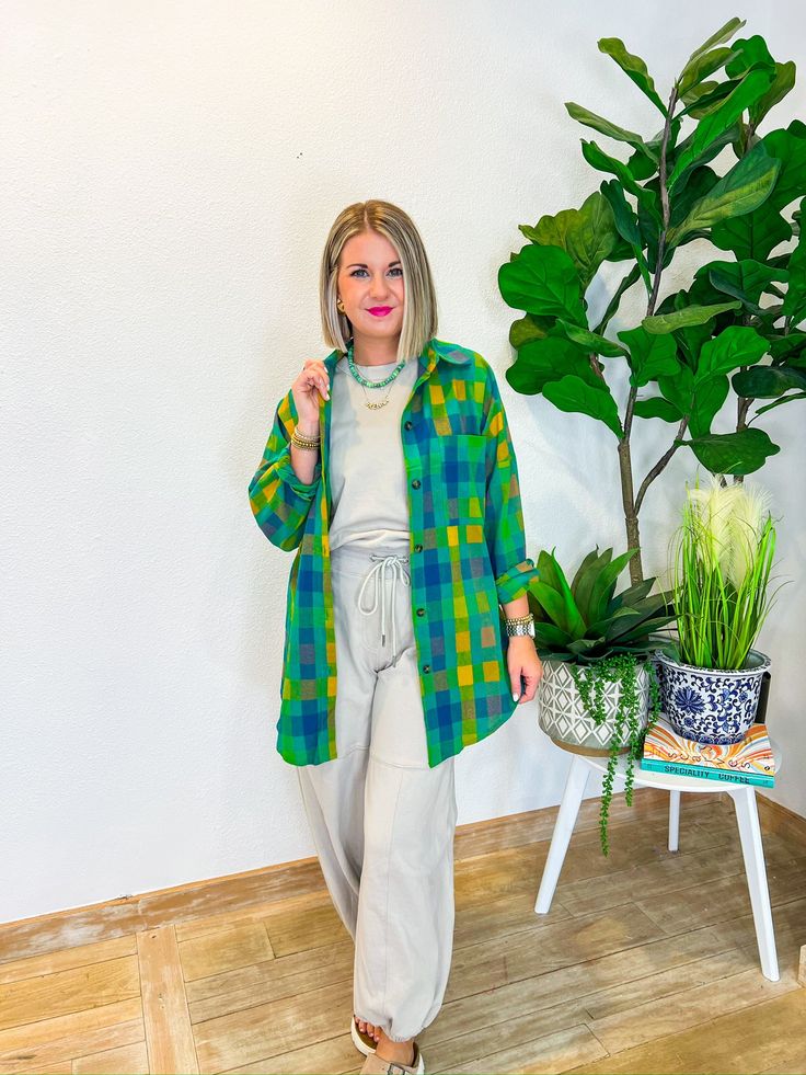 When the vacation vibes are calling, the Vacation Booked Button Down is the answer! With its playful blue and green hues, this lightweight shacket is your go-to for layering over anything from a chic jumpsuit to your favorite jeans. Perfect for breezy fall days, it’s an effortless addition to your wardrobe that’s as versatile as it is stylish. Wear it for a stroll through a fall farmers market or to cozy up at a weekend bonfire, and let this button-down become your ultimate travel companion. PRO Green Button-up Shacket, Trendy Blue Shacket For Spring, Casual Beach Outerwear, Spring Relaxed Fit Shacket For Day Out, Oversized Casual Shacket For Day Out, Casual Long Sleeve Shacket For Day Out, Green Button-up Outerwear For Day Out, Green Summer Outerwear For Vacation, Green Outerwear For Vacation In Spring