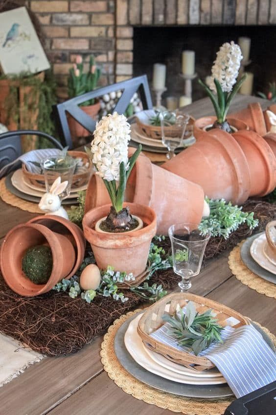 the table is set with dishes and place settings