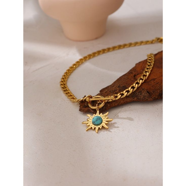 Metallic chain necklace with sun pendant in golden color. A true art piece that goes great with any style. Details Item Type: Fashion Necklaces Metal Type: Stainless Steel+Gold Plated Material: Enamel Chain Length: 44cm Pendant Size: 27*24mm Necklaces Style, Necklace Chain Types, Blue Stone Necklace, Gold Chain Choker, Sunflower Pendant, 18k Gold Chain, Sun Pendant, Sunflower Necklace, Toggle Necklace