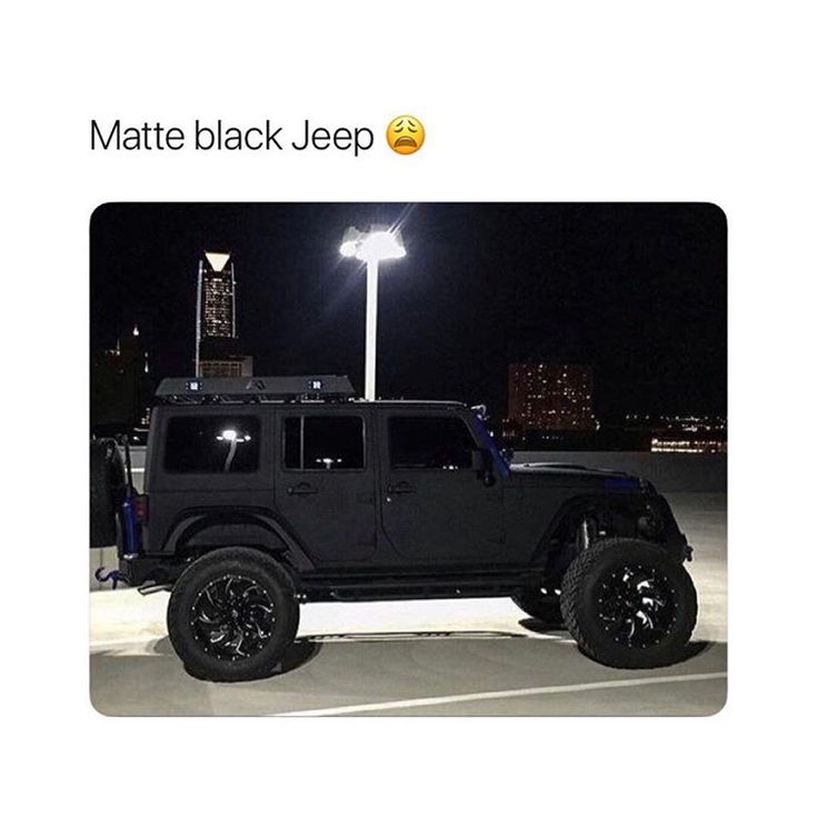 a black jeep parked in a parking lot at night with the caption matte black jeep