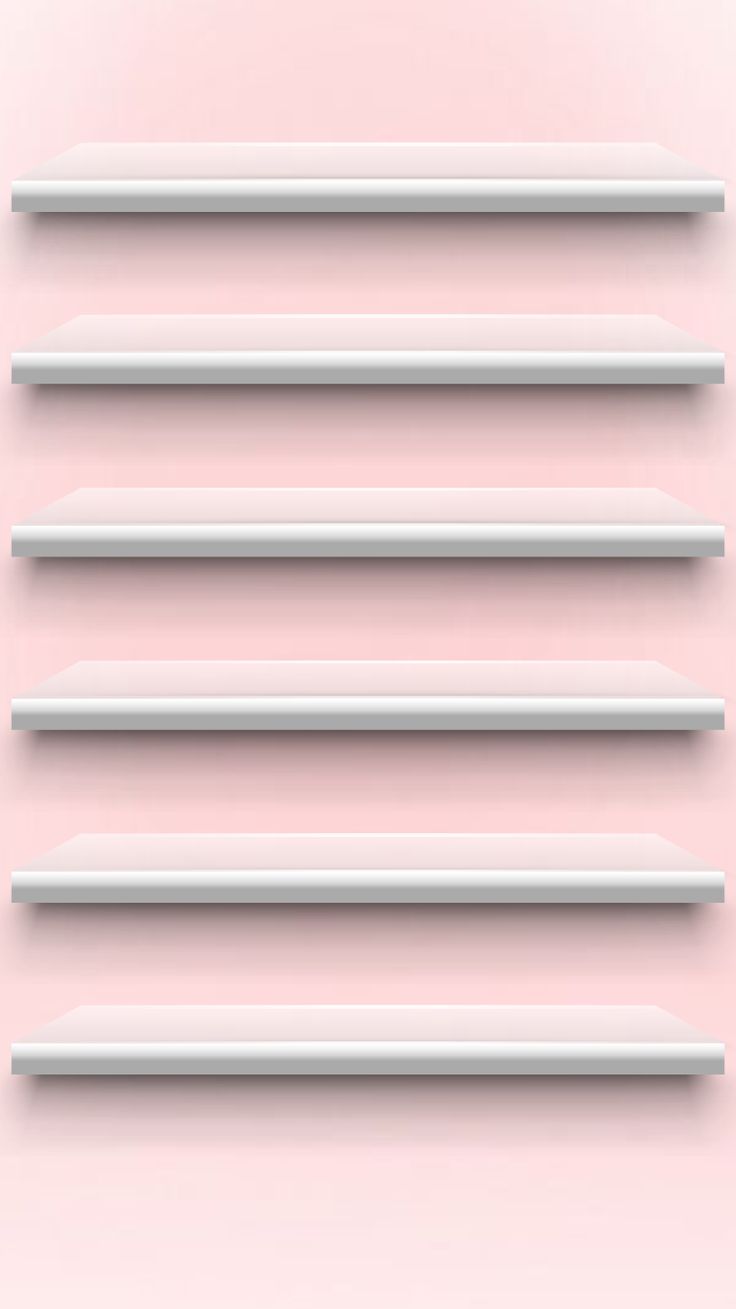 four white shelves are lined up against a pink wall