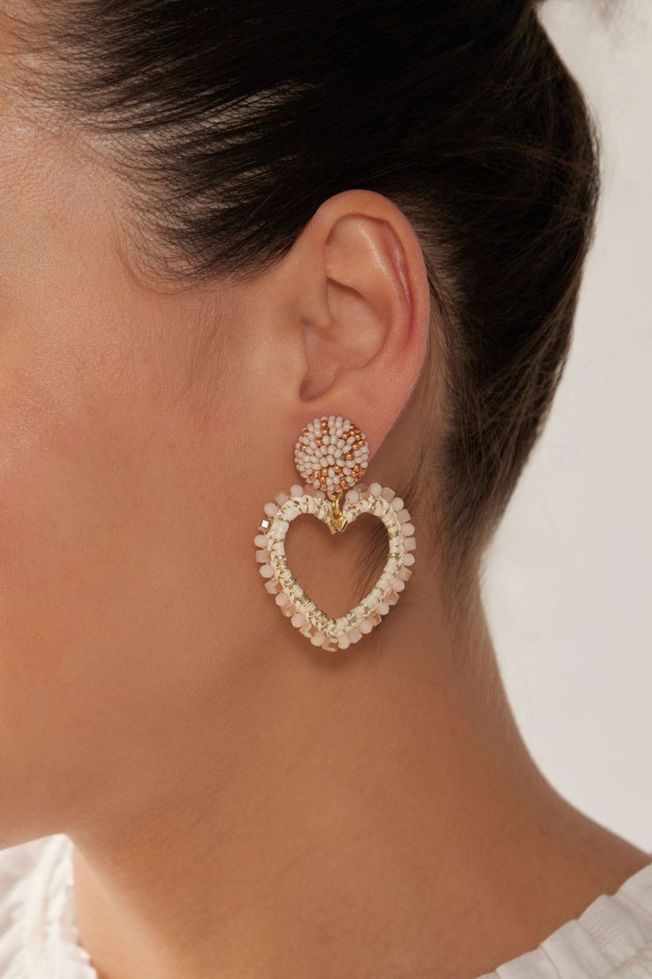 STYLE DETAILS: When sporting a slicked-back hairstyle or a chic up-do, a standout earring can really make your look pop! The Palme Earring is here to do just that. This earring features three stunning drop designs, each guaranteed to turn heads and earn you plenty of compliments wherever you go! FEATURES: Drop design Stud closure Brass, Cotton, Glass Beads, Plastic 5cm length Gabi The Label, Linen Bottoms, Unique Fits, Drop Design, Cream Style, Gold Colour, Drops Design, Mid Length Dresses, Heart Earrings