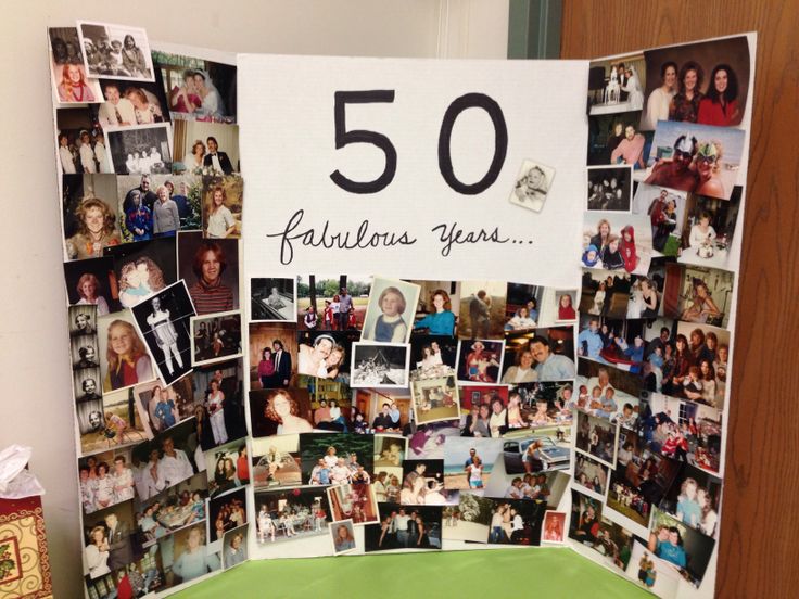 a table with a sign that says 50 fabulous years on it and pictures of people all over the place