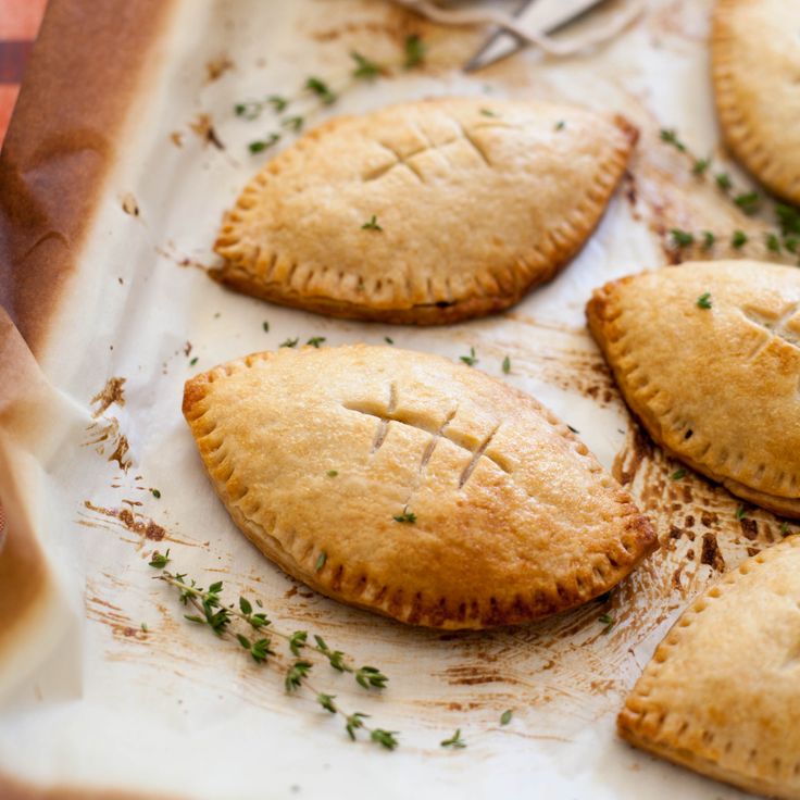 several small pies are sitting on a tray