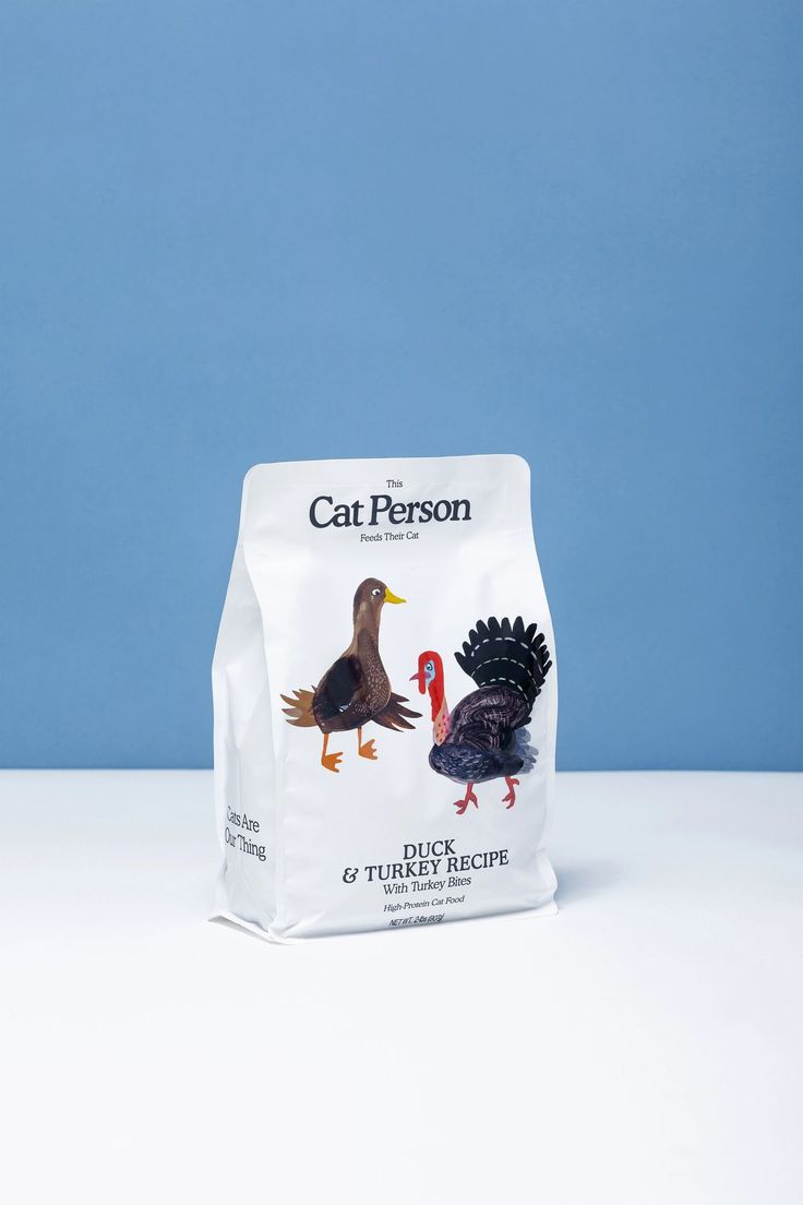 a bag of cat person turkey and turkey recipe on a white table with a blue background