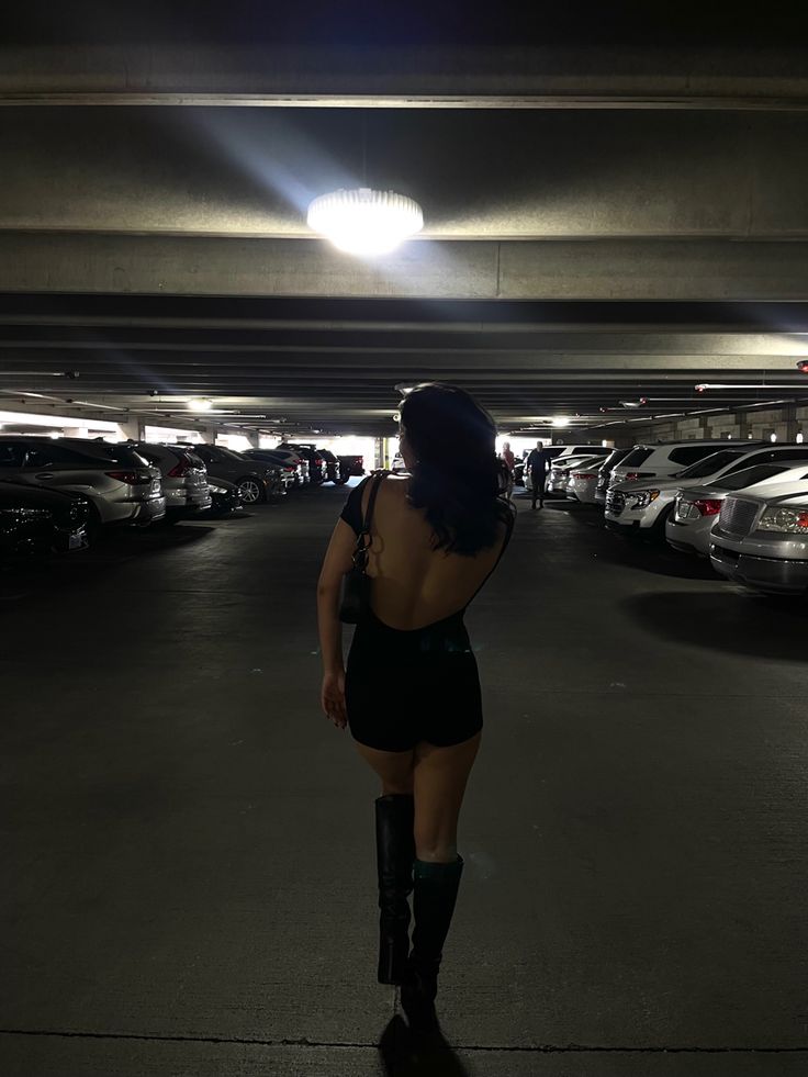 Black romper. Black boots. Fall outfit. Transitional outfit. Black outfit. Parking garage picture inspo. Parking Garage Photoshoot Two People, Car Garage Aesthetic Pictures, Photo Shoot In Parking Garage, Instagram Poses Parking Garage, Car Park Photo Ideas, Garage Inspo Pics, Nighttime Parking Garage Photoshoot, Ig Inspo Pics Parking Garage, Garage Aesthetic Pictures