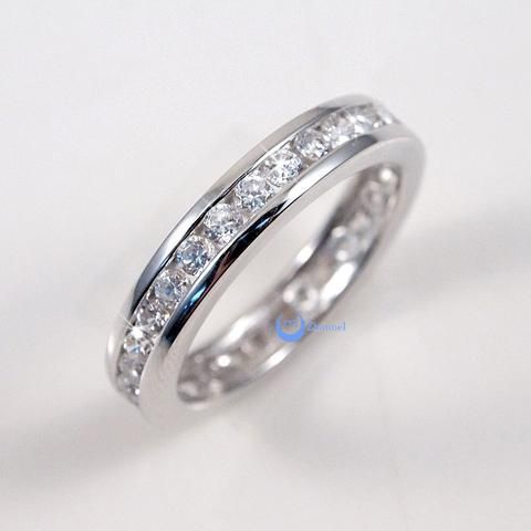 a white gold wedding ring with channeled diamonds