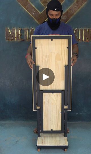 a man standing in front of a wooden sign with the words metal lining on it