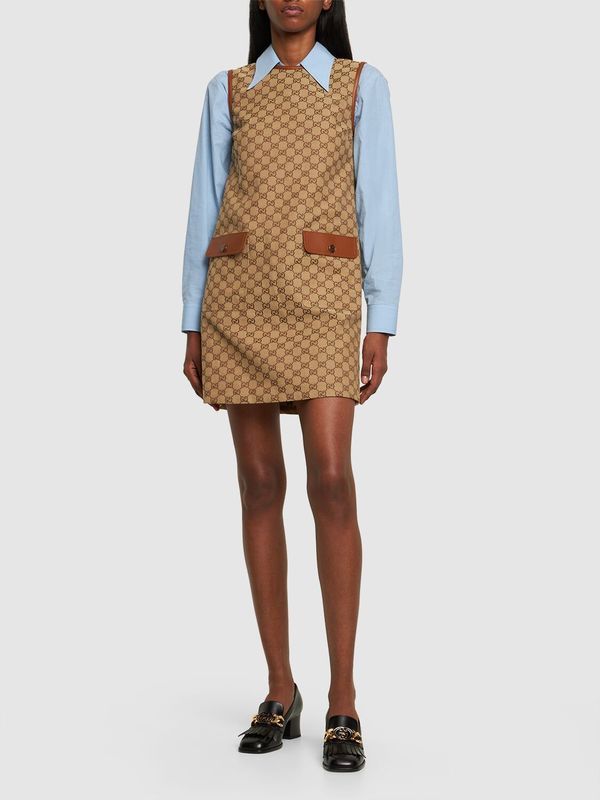 Find GUCCI Gg Cotton Blend Canvas Dress on Editorialist. Concealed back zip closure. Logo details. All over pattern placement may vary. Leather trim. Two front pockets. Unlined. Model is wearing a size38 Designer Cotton Spring Dresses, Designer Cotton Dresses For Spring, Designer Fall Workwear Dresses, Designer Workwear Dresses For Fall, Gucci Mini Length Dresses, Luxury Gucci Dress For Work, Luxury Gucci Dresses For Workwear, Designer Gucci Mini Dress, Chic Gucci Workwear Dresses